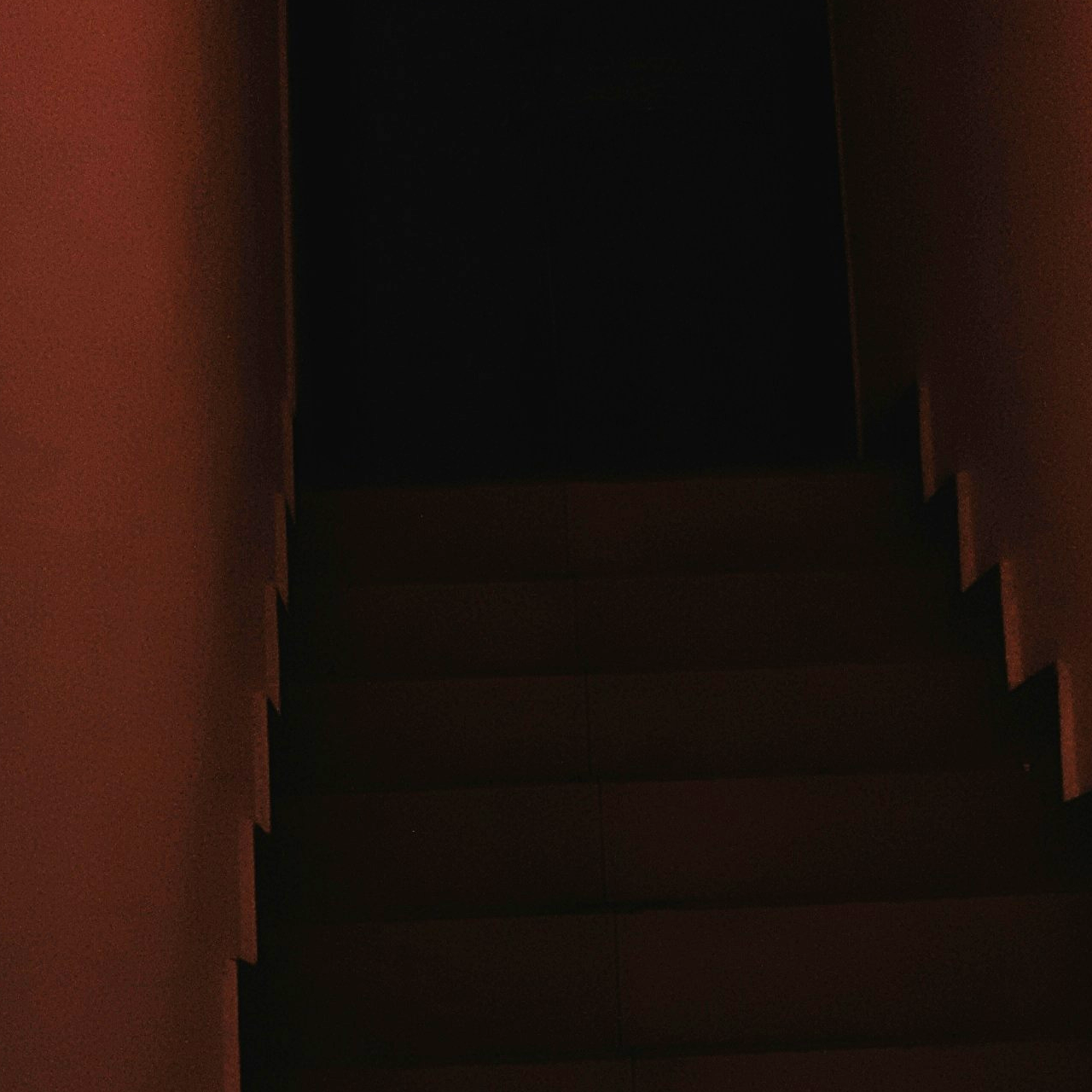 Dark, foreboding attic stairs. © Mertcan Kızılpınar